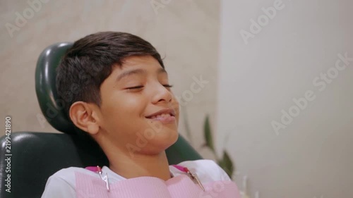 Contented boy waiting in a dentist's chair