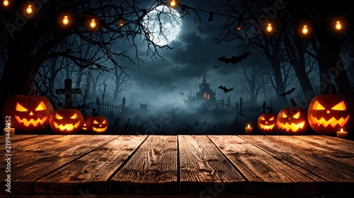 A spooky Halloween background featuring wooden planks, pumpkins, trees, and the moon against a horror-style night backdrop.
