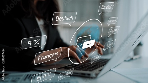 Multilingual Communication Concept with Hands typing on Laptop Surrounded by Speech Bubbles in Multiple Languages and Modern Workspace Setting Gluon.