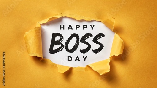 Happy Boss Day greeting text, yellow torn paper background with hole, professional appreciation message for corporate leadership and management