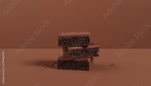 Brownies Stacked on a Brown Surface With a Plain Background