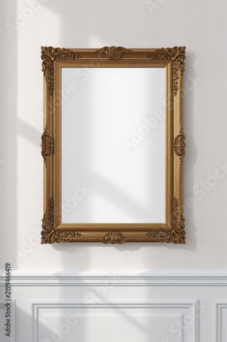Mirror With Ornate Gold Frame on a Wall in a Bright Room