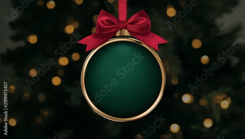 Christmas Ornament With Bow Hanging in Front of Blurred Tree Lights