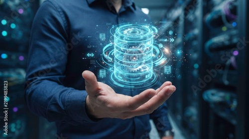 Futuristic Data Hub: A person's hand holds a glowing holographic representation of a digital data server, set against the backdrop of a modern data center.