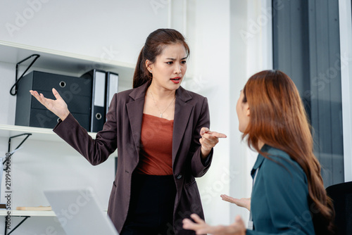 Businesswomen colleagues discussing serious issues expressing di