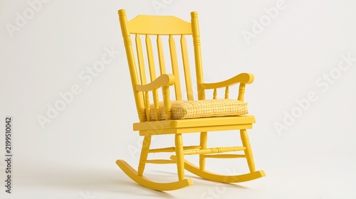 A bright yellow wooden rocking chair with a cushioned seat is set against a plain white background.