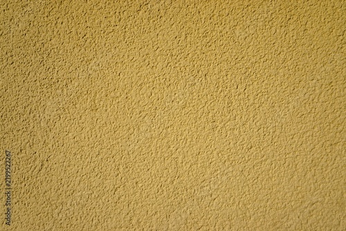 Gelbe raue Betonwand als Hintergrund