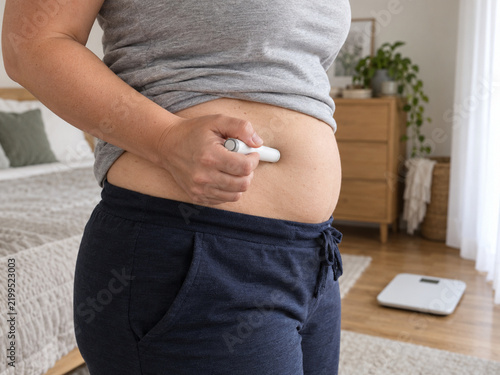 Adult Self Administering GLP-1 Weight Management Injection at Home
