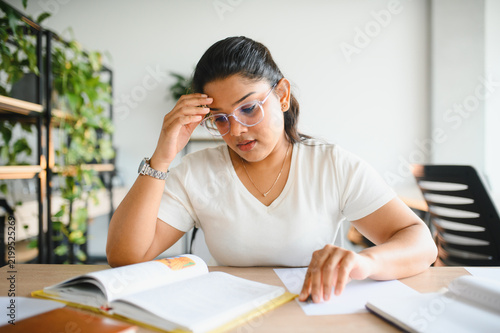 Fotografía Indian student feeling tired while studying hard