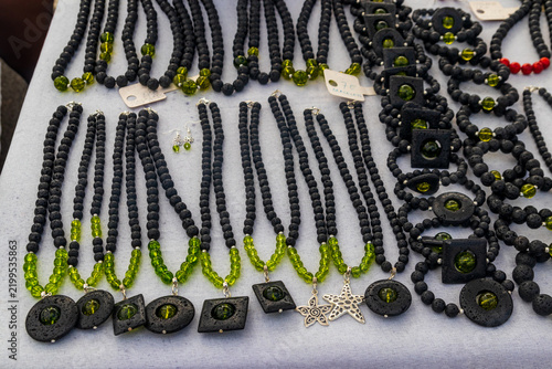Konstfotografi Assortment of artisan Canarian jewelry crafted from textured black lava stone an
