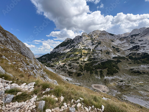 Rugged mountain basin beneath dramatic clouds