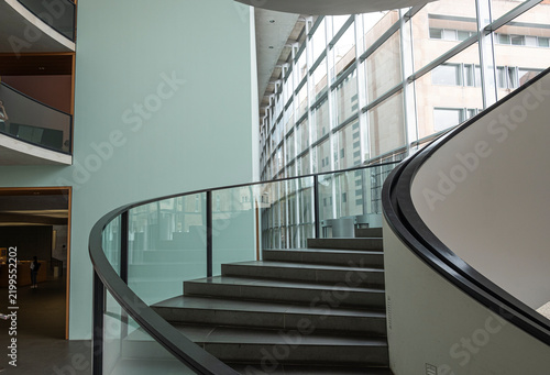Part of a Modern Minimalist Circular Staircase Against a White Background.