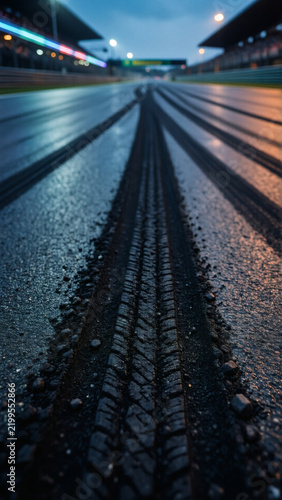 Close-up of tire marks on a damp racing surface