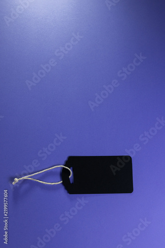 An empty black label with a purple background that can be used as a realistic mock-up