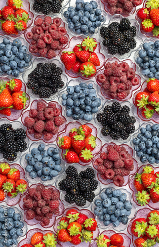 Vertical Flat Lay Of Mixed Berries In Glass Bowls. Blueberries Blackberries Raspberries And Strawberries Top View. Colorful Fruit Pattern