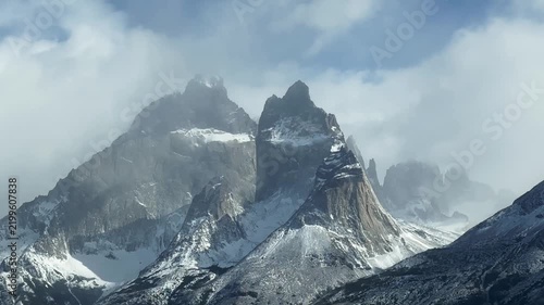 Clouds move over impressive mountain peaks, rocky peaks Cuerno Este and Cuerno Principal, time lapse, Torres del Paine National Park, Patagonia, Chile