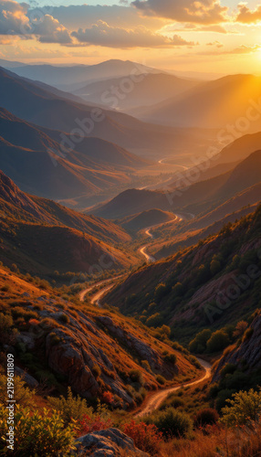 Winding mountain road sunset valley hills golden light scenic landscape nature outdoors travel adventure peaceful rural dirt path hillside autumn