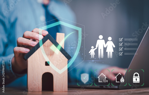 Obraz na płótnie An insurance agent presents home insurance, property protection, family security, risk management, disaster coverage, fire protection, flood insurance, and asset protection for safer homeownership