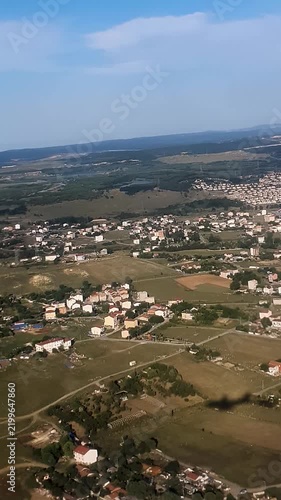 Aerial view of Istanbul from airplane window with plane shadow on the city
