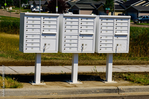 Three curbside lockable mailboxes in new residential area.