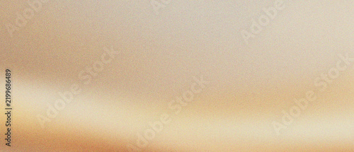 Abstract gold silk background with soft flowing waves. Elegant champagne satin texture with smooth light gradients. Luxurious metallic fabric surface for premium fashion and wedding designs.