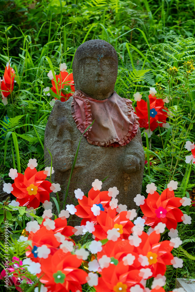 Fototapeta premium Windmills and Jizo statues in japan
