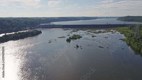 Aerial view of a large hydroelectric power plant on a wide river