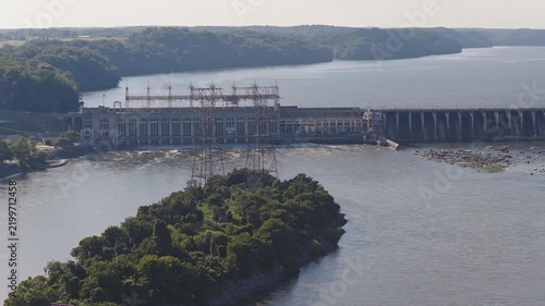 Aerial view of a large hydroelectric power plant on a wide river