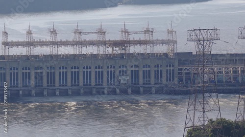 Aerial view of a large hydroelectric power plant on a wide river