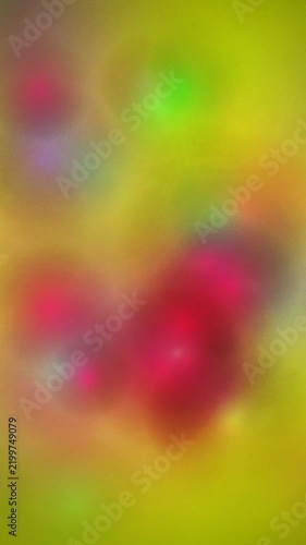Vertical abstract animation featuring soft glowing blurry colors shifting on a textured yellow background.