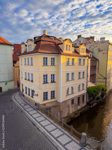 Bild auf Leinwand Canals flow between colorful buildings in Prague