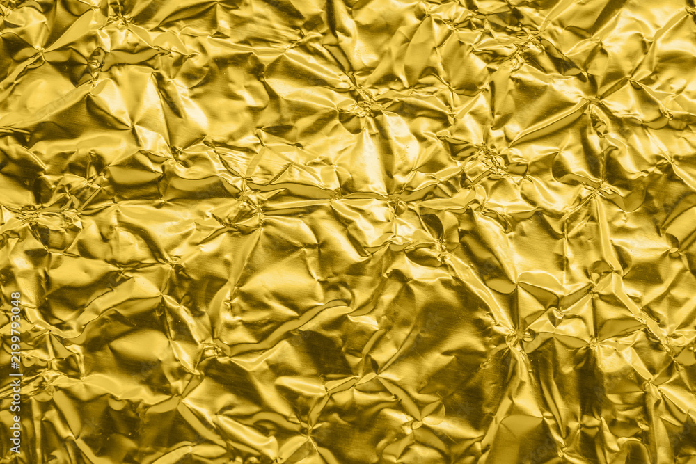 Obraz premium Luxury shiny metallic golden foil crumpled texture background
