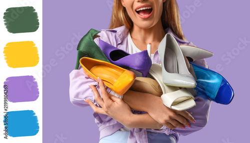 Картината върху платно Consumerism and shopping addiction, happy woman holding many colorful high heel