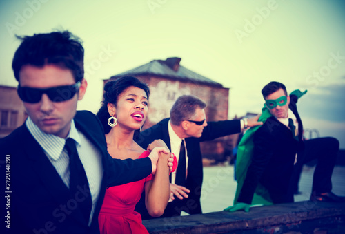 Принти на полотні Action Scene of Business People : A Hero in a Corporate Attire Trying to Save th