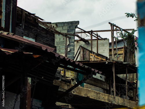 Foto Abandoned Building Demolition Site with Broken Wooden Structures and Overcast Sk