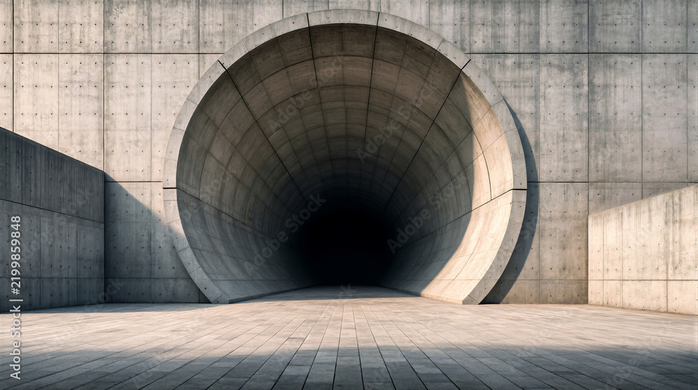 Fototapeta premium Minimalist architecture features an enormous circular tunnel opening embedded within a massive concrete wall and empty paved forecourt