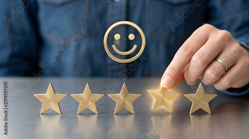 Customer feedback concept showing hand placing gold star for excellent service and best quality rating experience