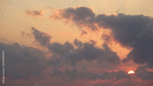 Obraz na płótnie Dramatic sunrise sky with glowing clouds and morning sun