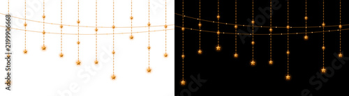 Hanging golden stars on decorative light strings for festive holiday decor isolated on white background and black backdrop