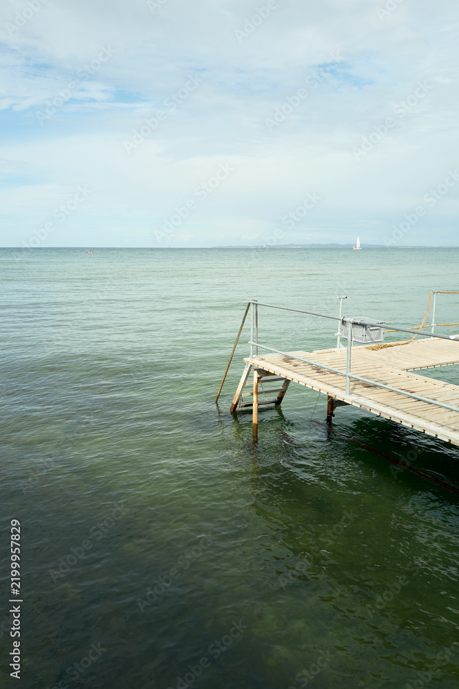Fototapeta premium Empty wooden jetty on a calm sea