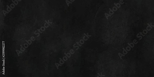 Soft black handmade paper texture background. Craft sheet with delicate fibre flecks.