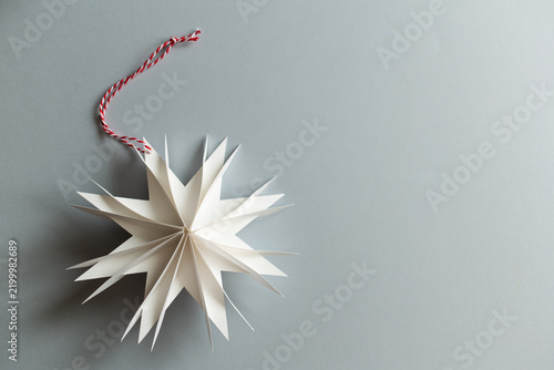 DIY gift handmade Christmas tree decorations: toy snowflakes star. paper craft for kids. create art for children.