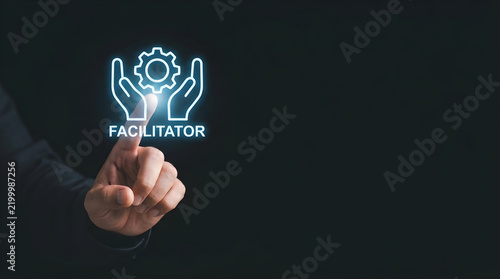 Business professional touching glowing facilitator icon representing corporate