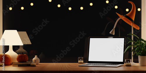 3D rendering of Cozy Night Laptop Mockup Desk with Witch Hat Lamp and Halloween Decor