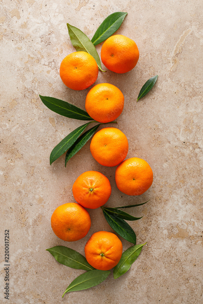 Obraz premium Mandarins fresh citrus fruit with green leaves