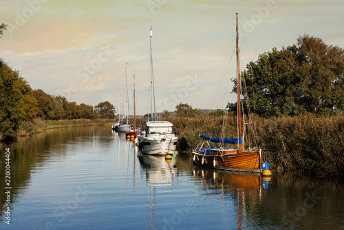 Boats moored on the River Frome near Wareham, Dorset, England
