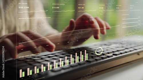 Hands type on a keyboard. A finance workspace brings growth, returns and working capital measures together, linking current results with forecasts and the management of business resources