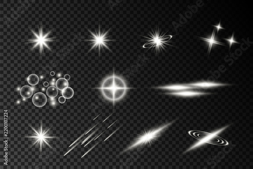 Collection of glowing white light effects, flares, sparkles, rays and luminous elements on transparent background.