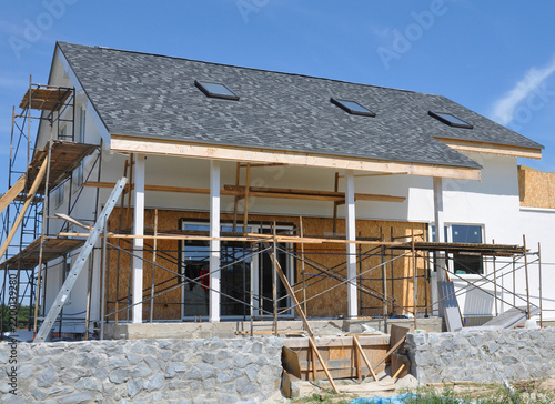 Painting walls, repair attic skylights, patio foundation during house facade renovation
