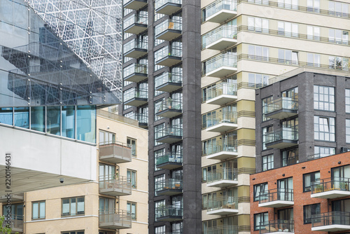 Modern multi-story residential apartment buildings featuring various facade textures, balconies, and contemporary architectural design in the city center of Nieuwegein, Netherlands.